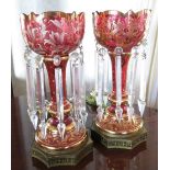 Pair cranberry glass & gilt enamel hurricane lamps