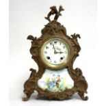 19thc French bronze clock With hand painted Sevres plaque. Approx. 14" H x  10" W x 4 1/4" D.