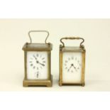 2 French Crystal & Brass Carriage Clocks 1 with alarm. 1 clock stamped France. Approx. 4  1/4" H.