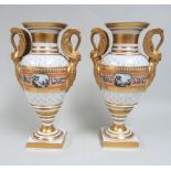 Pair of empire porcelain urns Hand painted, gilded swan handle. Paintings of  castle on front and en