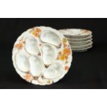 Lot of Limoges Oyster Plates With floral design. Approx. 8" D. 6 pieces total.