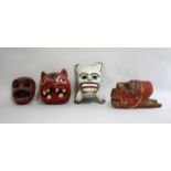 4 polychrome wood carnival masks The largest approx.10" H. (4050) Paint chipped and  worn Paint