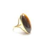 Large 14kt gold & tiger eye ring Approx. 5.3 dwts.