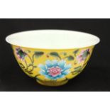 "Falancai" yellow ground floral bowl With Kangxi mark. Approx. 3 1/2" H x 6 1/2" D.