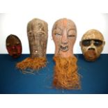 4 large carved African tribal masks Some from Lubin Galleries. Largest approx. 18" H.  (4050)