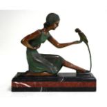 Bronze girl with parakeet-recast Rouge marble base. Signed Chiparus. Approx. 14  1/2" H x 15 1/2" W.