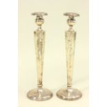 Pair of Sterling Silver Candlesticks Approx. 12" H. Weighs approx. 8ozt. some pitting some pitting