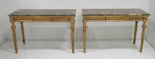 Pair of Marble Top Carves Console Tables circa mid 20th century. With gold leaf. Heavily  carved,