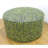 Large Upholstered Circular Banquette Upholstered in cotton leopard print.