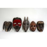 5 small carved African masks Some from Lubin Galleries. The largest approx. 13"  H.  (4050) Paint