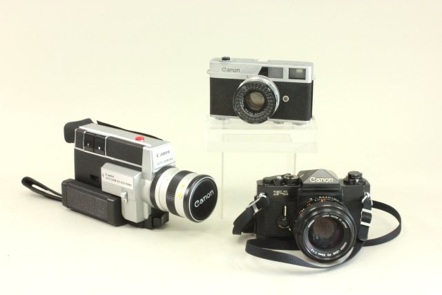 3 Canon Cameras Circa 1960's. In cases.