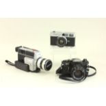 3 Canon Cameras Circa 1960's. In cases.
