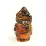 Chinese Amber Snuff Bottle Depicting Buddhas. Approx. 2 1/2" H with stopper.  Approx. 29.6 gms.