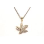 14k Starfish Pendant with Diamonds 14k white gold chain. Approx. 3.2 dwt. (4087)