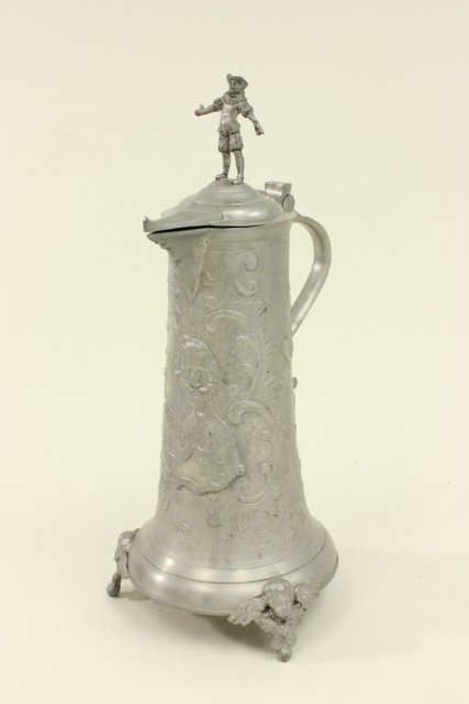 Pewter Figural Flagon Angel feet. Figure on top. Floral design. Approx  15" H.