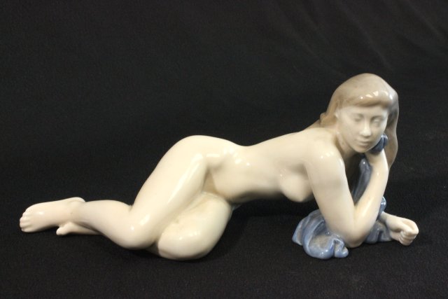 Royal Copenhagen Reclining Nude with Blue Towel #4703. Approx. 9" L. (4093)