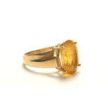 14k gold ring with yellow stone Approx. 3.3 dwt with stones. (4071)