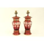 Pair of Cranberry Bohemian Glass lamps Cut to clear, decorated with grapes on wooden  bases. Approx.