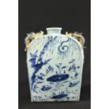 Blue & White Moon Flask With dragon design. Approx. 9 1/2" H. Minor losses  to dragon. Minor