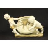 Amphora Austrian Pottery Figural Centerpiece Two cherubs holding basket. Approx. 8" H x 14 1/2"