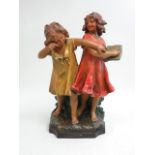 Patinated Terracotta Sculpture of 2 School Girls Seal mark on back. Approx. 20 1/2" H. Name plate