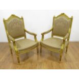 2 Louis XVI Style French Armchairs Gold fabric. Approx. 36" H x 24" W x 24" D.