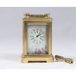 Reproduction Miniature Sèvres Style Carriage Clock With floral motif. With key. Approx. 2 1/2" H x 1