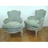 Pair of Louis XV style white painted Bergères Approx. 35" H x 26" W x 29" D.