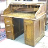 American Oak S-Roll Desk with Full Interior Approx. 43 1/2" H x 44" W x 29 1/2" D.