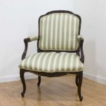 French Carved Walnut Armchair Circa 19th-20th Century. Approx. 38 1/2" H x 26  1/2" W arm to arm.