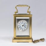 Reproduction Silver Dial Miniature Carriage Clock With key. Approx. 2 1/2" H x 1 1/2" W x 1 1/4" D.