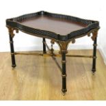 Tray Top Table Mahogany banded top. Gallery lift up top. Black  and gold decorated. Faux bamboo legs