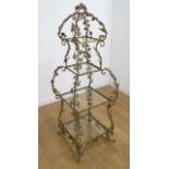 4 Tier Gilt Metal Floral Glass Stand Approx. 52" H x 19" W x 19" D. Crack in glass on  second
