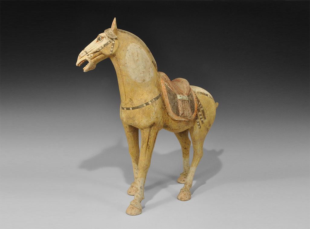 Chinese Large Ceramic Walking Horse Tang Dynasty, 618-906 AD. A finely modelled figurine of a