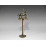 Roman Bronze Oil Lamp with Bird Lid and Tripod Stand 3rd century AD. A mixed group comprising: a