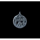 Viking Silver Pendant with Raven 11th century AD. A discoid pendant with loop, openwork design of