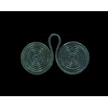 Bronze Age Double Spiral Pendant 2nd millennium BC. A pendant formed as two coils of round-section