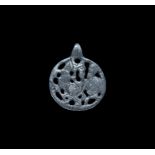 Viking Silver Pendant with Enmeshed Dragon 11th-12th century AD. A flat-section disc pendant with