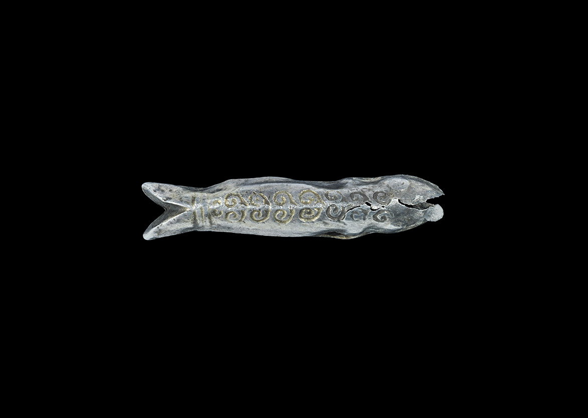 Viking Silver-Gilt Fish Pendant 9th-11th century AD. A fabricated sheet-silver pendant in the form