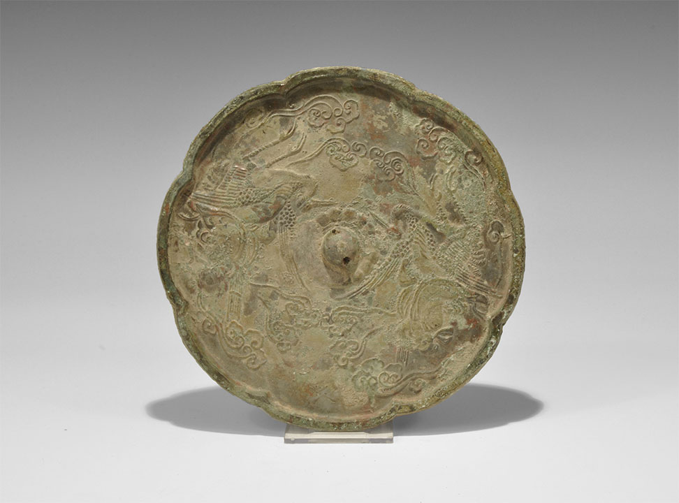 Chinese Bronze Mirror with Cranes Tang Dynasty, 618-906 AD. An octofoil mirror with one polished