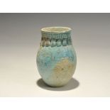 "20th century AD. A pale blue glazed composition jar with ribbed neck and piriform plaques to the