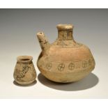 "3300-1300 BC. A mixed group of terracotta vessels comprising: a bulbous jug with rounded underside,