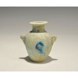 "20th century AD. A glazed composition jar with lateral lug handles, flared rim with painted