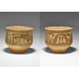 "3300-1700 BC. A terracotta cup of carinated profile, polychrome painted panels of geometric