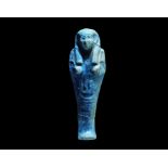 ". A deep blue undated archaistic glazed composition shabti in Late Period, 664-332 BC style, with
