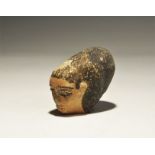 ". An undated archaistic hollow-formed ceramic head with painted facial details and hair. 126 grams,