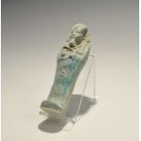 "20th century AD. A blue glazed composition shabti with agricultural implements in the crossed