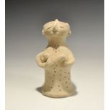 "20th century AD. A bell-shaped ceramic figurine with globular head; applied arms supporting the