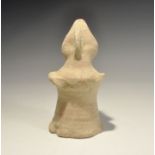 "20th century AD. A bell-shaped ceramic figurine with lozengiform head; applied arms and facial