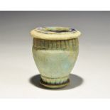 "20th century AD. A blue glazed composition jar with bands to billets to the shoulder and foot,